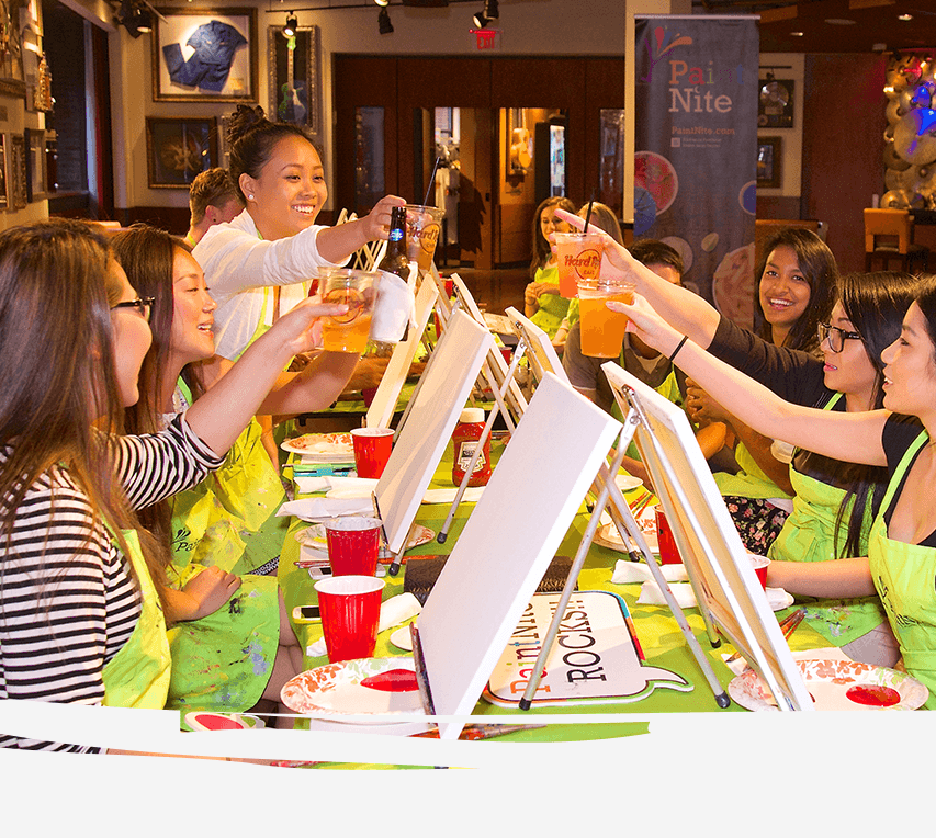 Guests arranging flowers at a PaintNite.com Flower Workshop