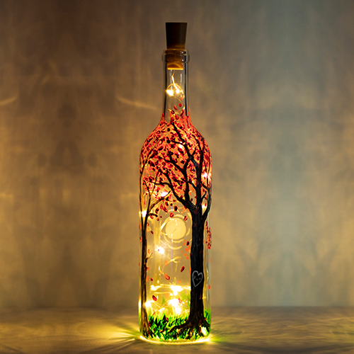A Blossoming Forest Magic Wine Bottle with Fairy Lights paint nite project by Yaymaker