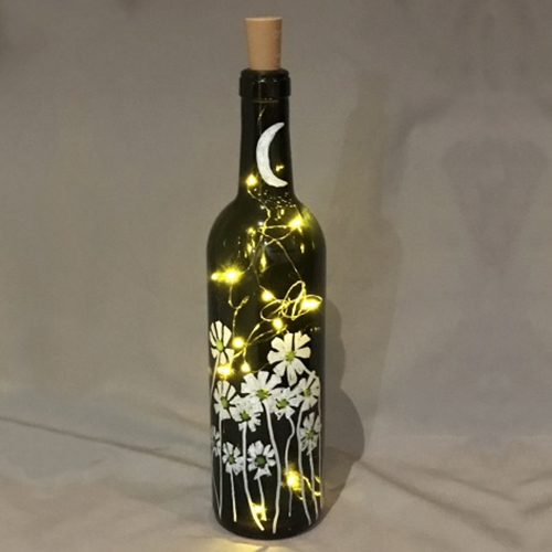A Fireflies and Daisies Twinkle Lights Wine Bottle paint nite project by Yaymaker