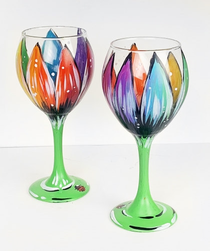 A Rainbow Flower Wine Glasses with a Ladybug paint nite project by Yaymaker
