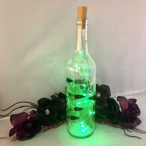A Wicked Magic Potion Wine Bottles  Fairy Lights paint nite project by Yaymaker