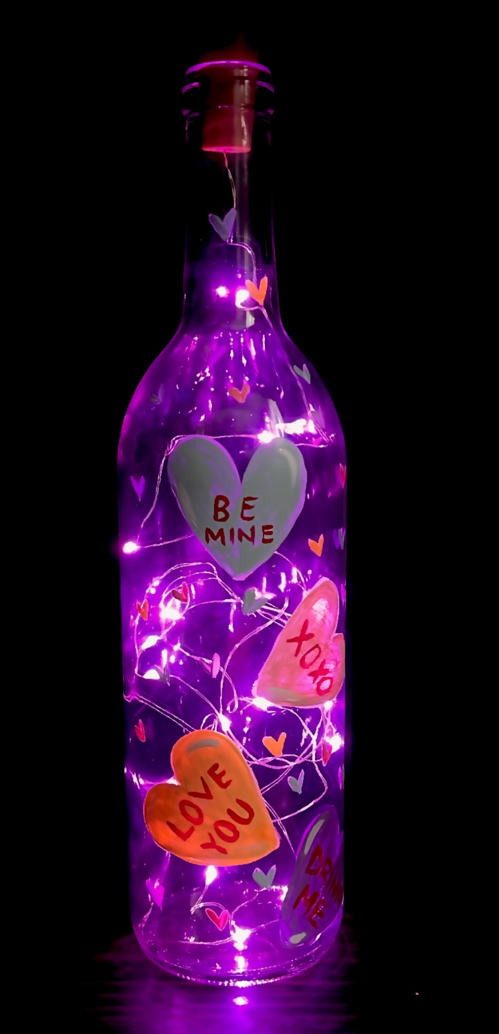 A Candy hearts wine bottle with pink fairy lights  experience project by Yaymaker