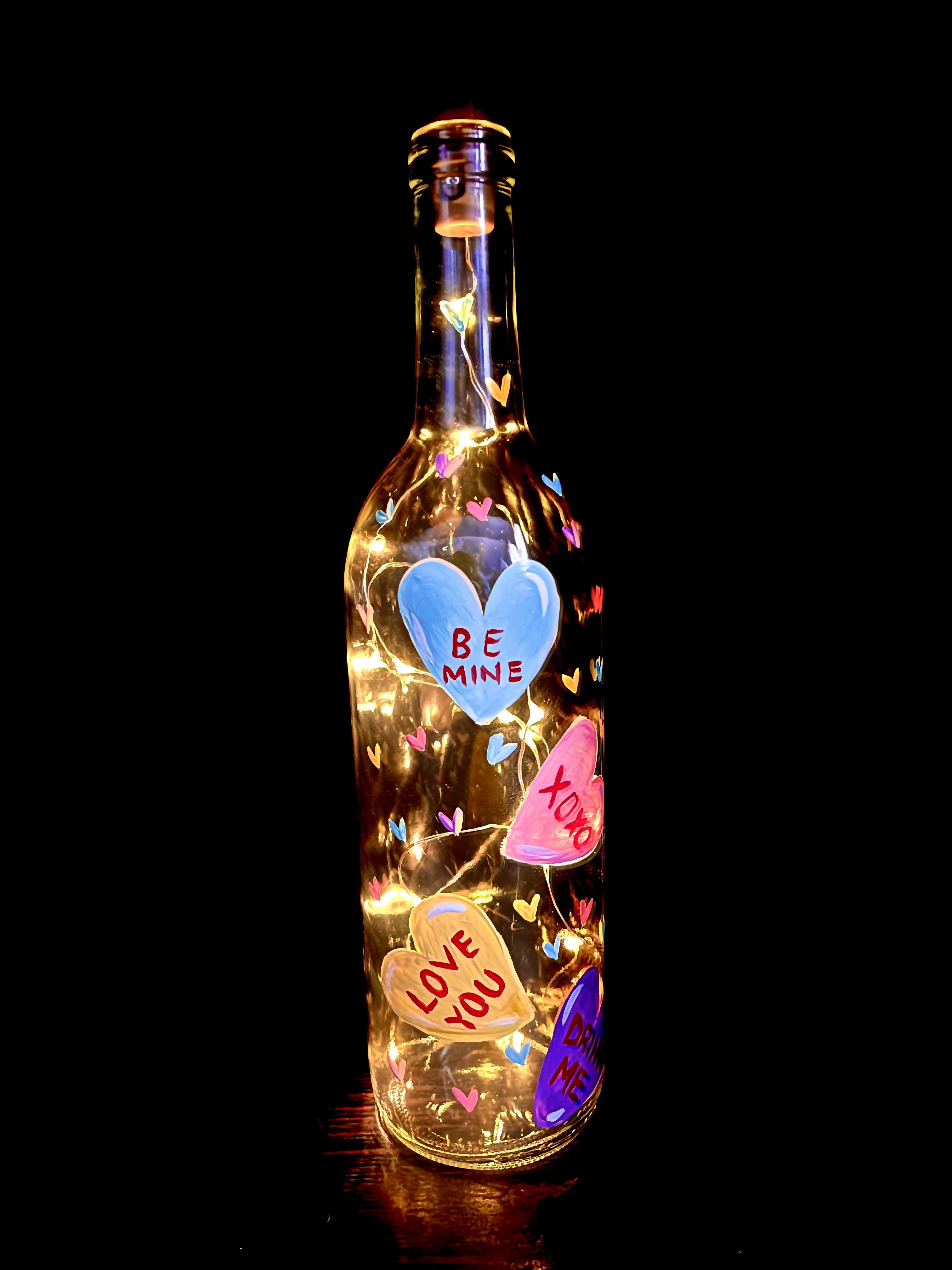 A Candy hearts Valentines Day wine bottle with fairy lights  experience project by Yaymaker